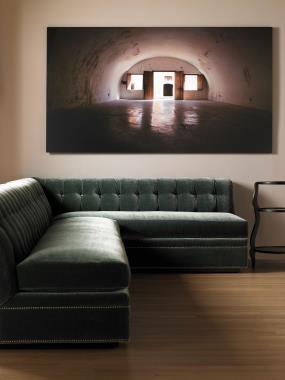Room Scene: One HC123-52 Kent 102-inch M2M® Armless Sofa and one 84-inch HC123-53 Kent
M2M® LAF Armless Corner Sofa - Special Construction with contrasting leather
buttons, weltless with NS-09 nail trim and with a custom plinth base finished in Dark
Walnut finish.
