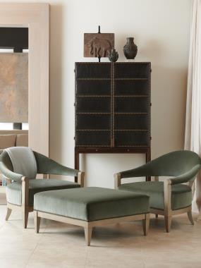 Room Scene: HC7267-70 Russell Cabinet shown in optional Dark Walnut finish and in COL leather  with NS-05 Small Natural Nail head trim and HC7218-22 Crescent Chair and HC7218-29 Ottoman shown in optional Weathered Stone paint with  "optional nails (up-charge)" and in COM fabric.