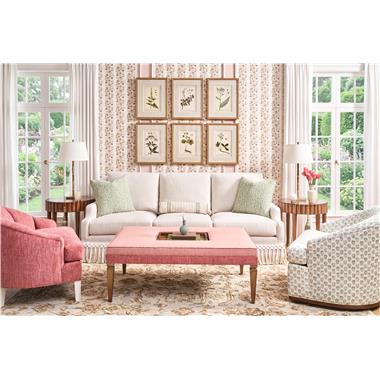 Room Scene: PE6718-30 Harrison Sofa – Kickpleat Skirt shown in HC703-13 fabric with HCBF-10 fringe; PE6738-00 Liam Chair shown in HC495-53 fabric and Weathered White finish; PE6741-50 Max Rectangular Cocktail Ottoman shown in HCD42106-0005 top fabric and welt with HC495-53 on bottom and Hable Grey finish; PE6743-00 Nicholas Swivel Chair shown in HC507-72 fabric and Truffle finish and HC4506-70 Scalla End Table shown in Truffle finish.