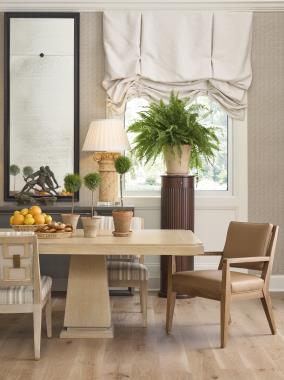 Room Scene: HC3507-70 Monterey Dining Table shown in Ecru finish; HC3437-01 Beal Dining Arm Chair shown in HC55 Colours Leather and Chesnut finish; HC3437-01 Beal Dining Side Chair shown in HC4539-16 fabric on seat and back with HC235-11 fabric on outside back and Ecru finish and HC3446-70 Hatton Credenza shown in Slate finish.