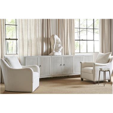 HC4600-C3 Textures Six Door Credenza shown in optional Weathered White paint
with F5 Reeded Doors, SL Saber Legs, N2 Antique Bronze Drop Pull and P2 Centered
on Inner Edge Door placement, HC9509-SW Jules Swivel Chair with B3-Upholstered
Base, AR3-Saddle Arm and in fabric HC401-10, HC9509-CH Jules Chair with AR4-
Key Arm, B2-Tapered Leg Base shown in optional Ebony finish, in fabric HC401-10 and
with NP-09 nail head trim at arm and base, HC5388-10 Grace Spot Table Base and
HC8030-01 Grace Bowl.