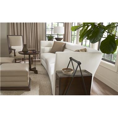 Room Scene: HC7225-08 Questa Sofa shown in fabric HC320-10 and standard throw pillows shown in COM fabric, HC7201-23 Cleft Foot Chair shown in fabric HC4410-16 and in standard Truffle finish, HC7204-29 Zaftig Ottomans shown in leather HC930 and in standard Truffle finish, HC7383-10 Tilda Side Table shown in standard Truffle finish and HC7246-70 
shown in optional java finish.