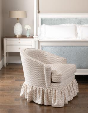 Room Scene: HC6707-27 Ember Skirted Swivel Lounge Chair shown in fabric HC804-52-LIBERTY, HC9762-10 Left Bank King Bed shown in fabric HC466-33 and Cream Linen finish and HC9766-70 Left Bank Nightstand shown in Truffle finish on top with Cream lined finish on base and Antique Brass pull out knob & COH hardware on drawers.